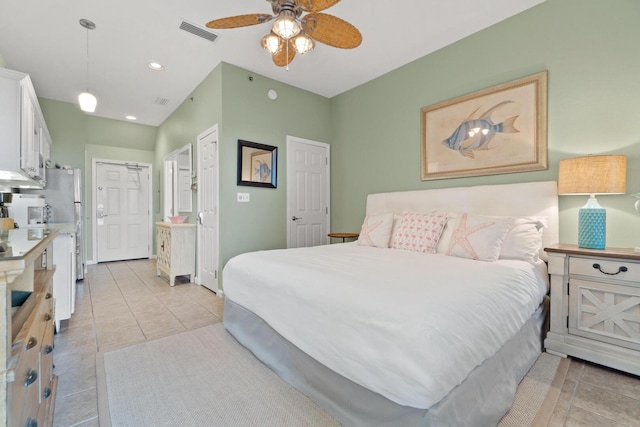 bedroom featuring ceiling fan and light tile floors