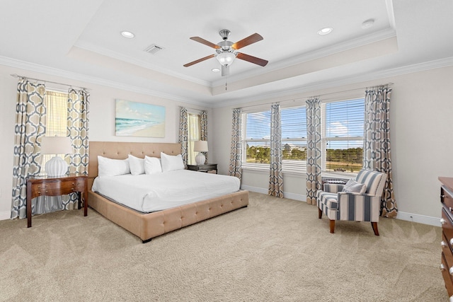 bedroom featuring a raised ceiling, ceiling fan, and crown molding