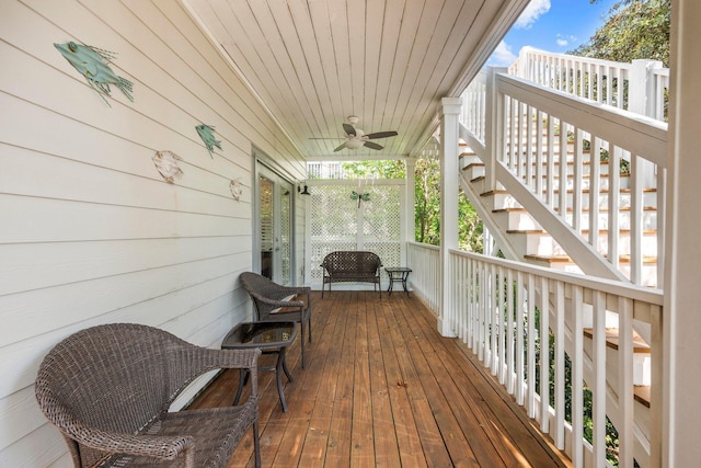 deck with ceiling fan and a porch
