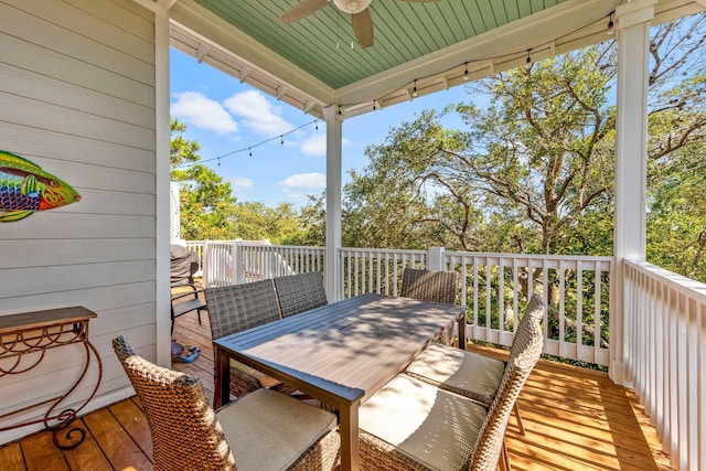 wooden deck featuring ceiling fan
