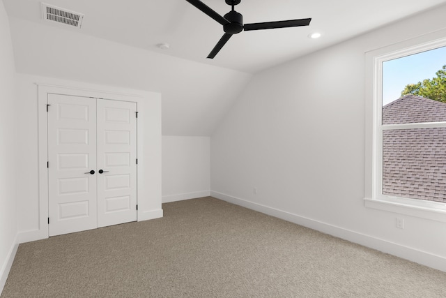 bonus room featuring ceiling fan, lofted ceiling, and carpet floors