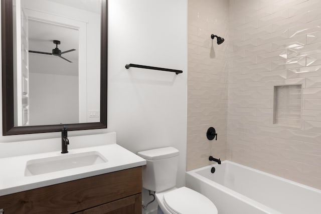 full bathroom featuring toilet, vanity, and tiled shower / bath