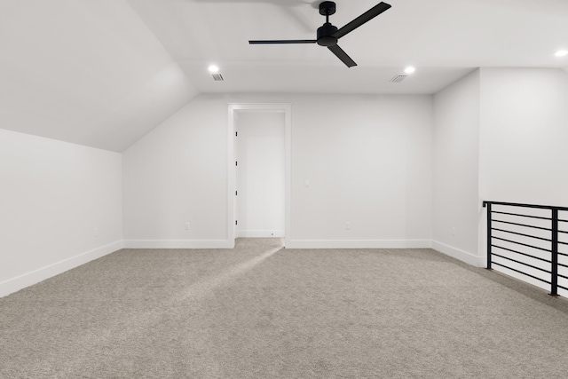 additional living space featuring carpet, ceiling fan, and lofted ceiling