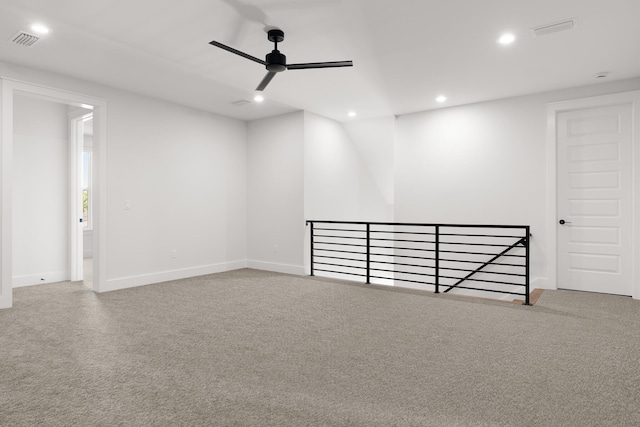 unfurnished room featuring carpet flooring and ceiling fan