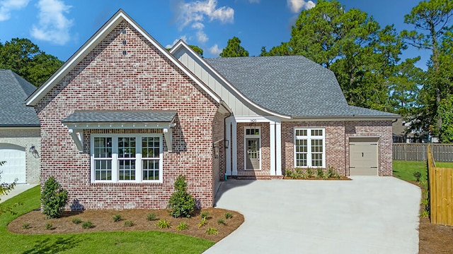 view of front facade featuring a garage and a front lawn