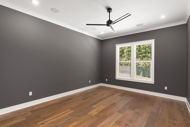 unfurnished room featuring wood-type flooring, ceiling fan, and ornamental molding