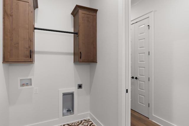 laundry room featuring cabinets, dark hardwood / wood-style flooring, washer hookup, and hookup for an electric dryer