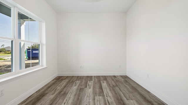 spare room featuring hardwood / wood-style flooring