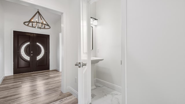 entrance foyer with a chandelier