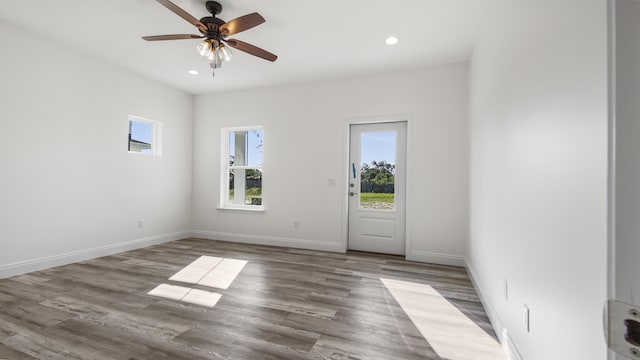 empty room featuring wood-type flooring and ceiling fan