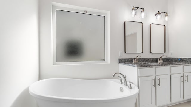 bathroom featuring a bathtub and vanity