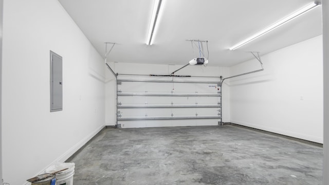 garage featuring electric panel and a garage door opener