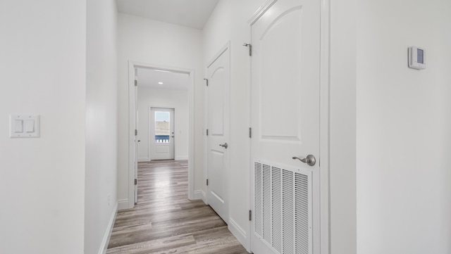 corridor featuring light hardwood / wood-style flooring