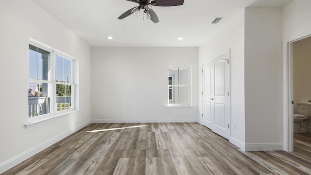 spare room with ceiling fan and hardwood / wood-style floors