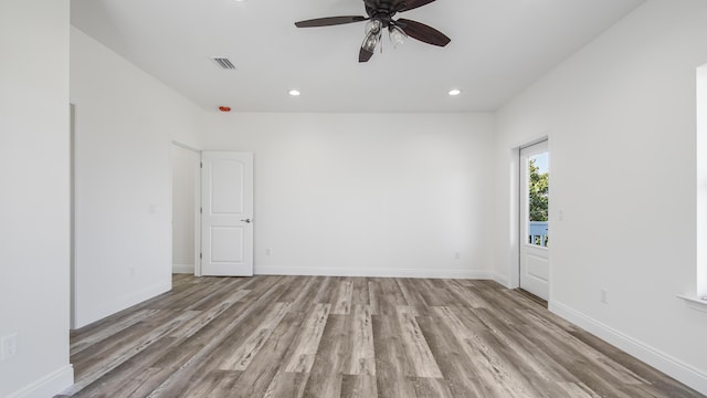 unfurnished room featuring ceiling fan and light wood-type flooring