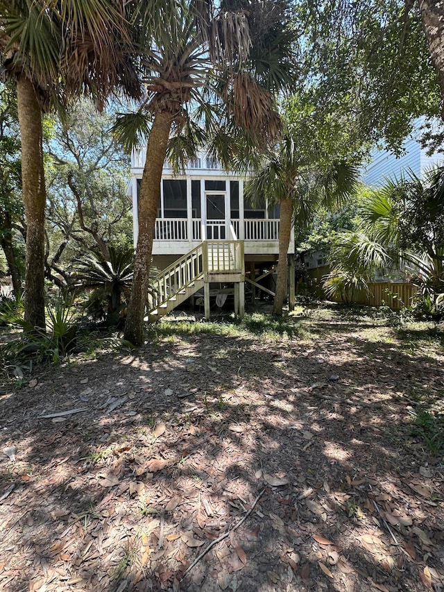 view of front of house featuring a sunroom