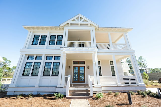 view of front of home featuring french doors and a balcony