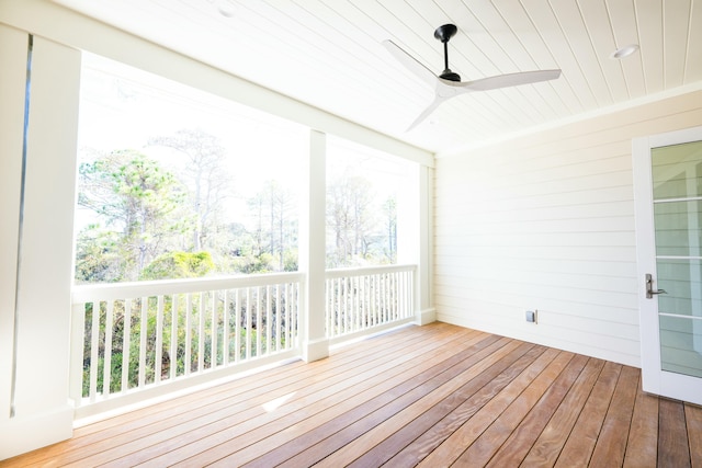 unfurnished sunroom featuring ceiling fan and wood ceiling