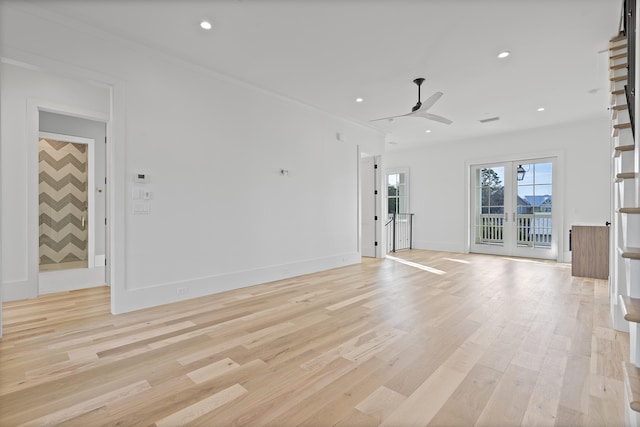 unfurnished living room featuring crown molding, ceiling fan, and light hardwood / wood-style flooring