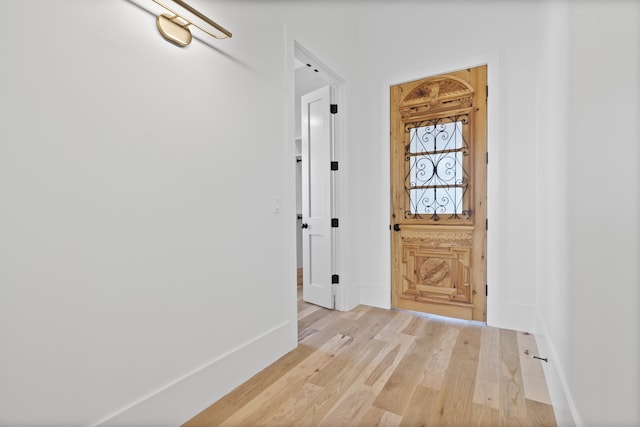 corridor with light wood-type flooring