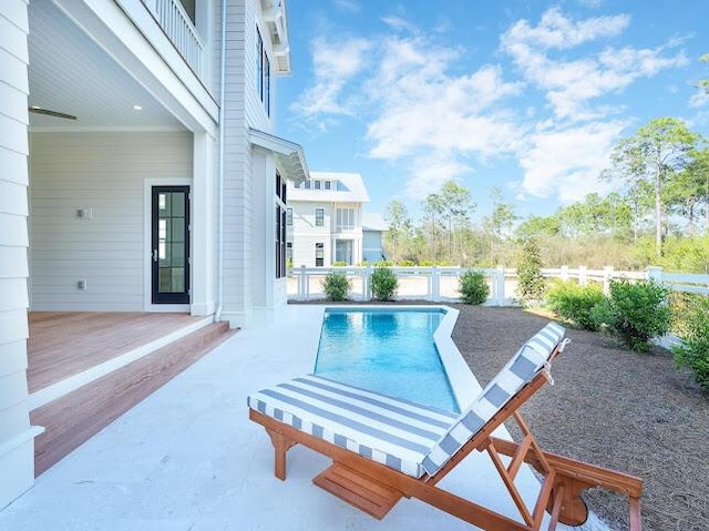 view of pool with a patio area, a fenced backyard, and a fenced in pool