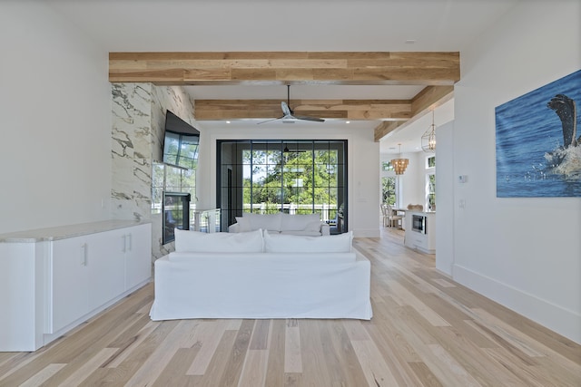 114 Climbing Rose Way, Santa Rosa Beach, FL 32459 - living room with ceiling fan, light wood-type flooring, beam ceiling, and a chandelier