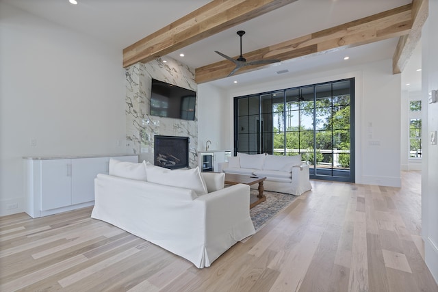 114 Climbing Rose Way, Santa Rosa Beach, FL 32459 - living room featuring a high end fireplace, light wood-type flooring, a ceiling fan, beam ceiling, and recessed lighting