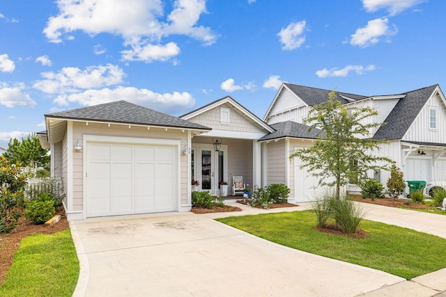 view of front of property with a garage and a front lawn