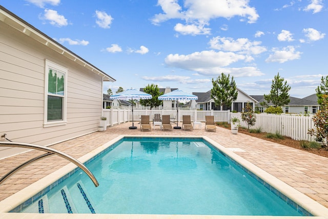 view of swimming pool featuring a patio area