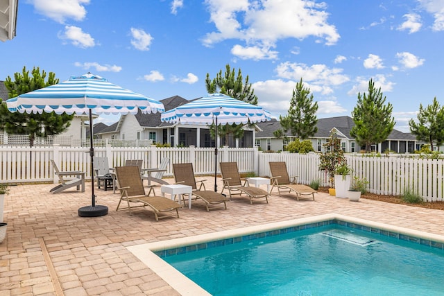 view of swimming pool with a patio