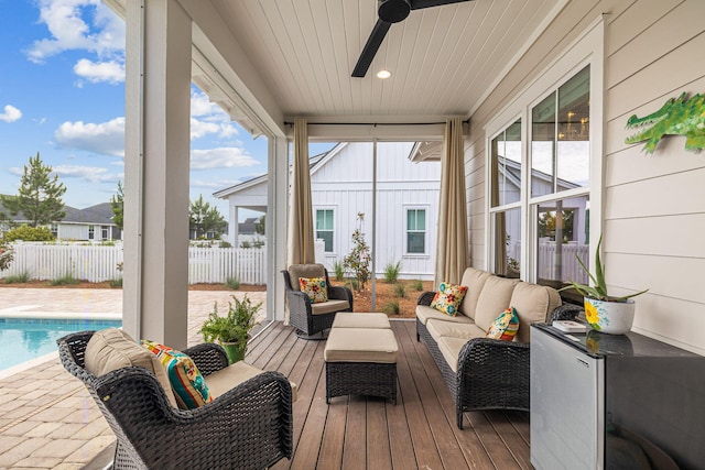 sunroom featuring plenty of natural light and ceiling fan