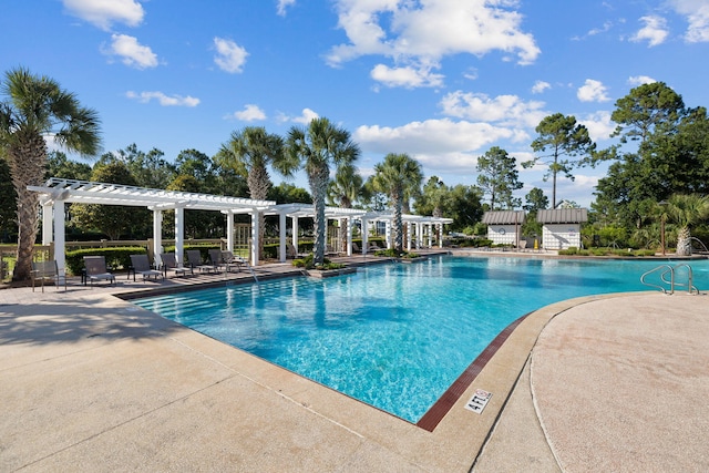 view of swimming pool with a pergola and a patio area