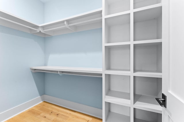 walk in closet featuring hardwood / wood-style floors