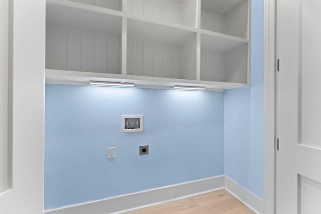 clothes washing area with hookup for a washing machine, wood-type flooring, and hookup for an electric dryer