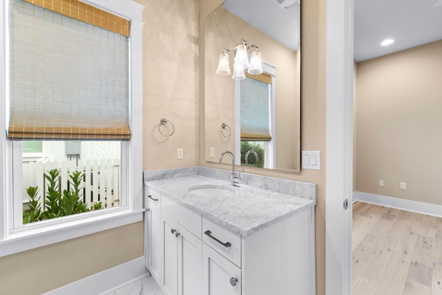 bathroom with wood-type flooring and vanity