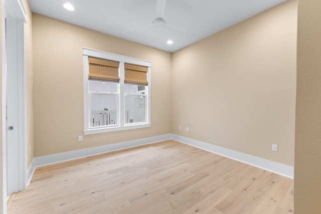 empty room featuring ceiling fan and light hardwood / wood-style flooring