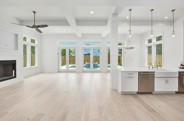 kitchen with white cabinetry, dishwasher, pendant lighting, and sink