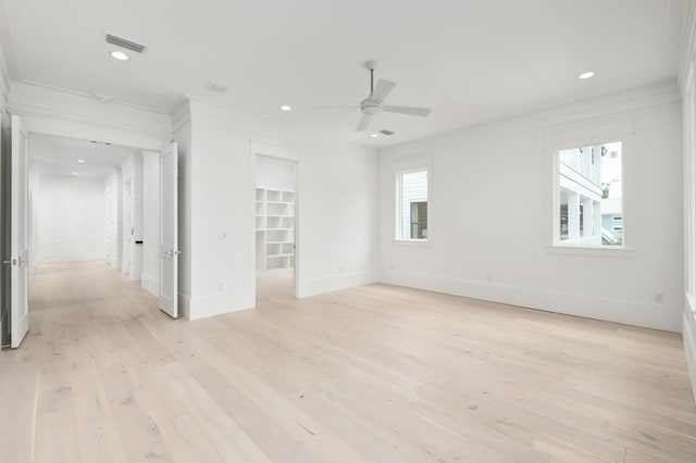 unfurnished room with ceiling fan, a healthy amount of sunlight, and light hardwood / wood-style floors