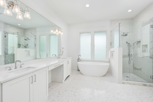 bathroom featuring separate shower and tub and vanity