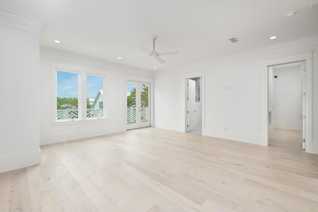 spare room with ceiling fan and light hardwood / wood-style flooring