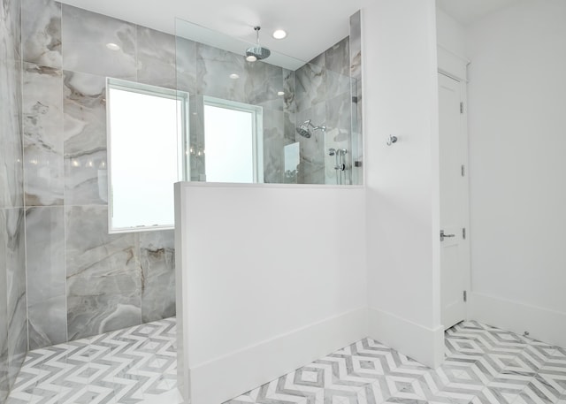 bathroom with tiled shower