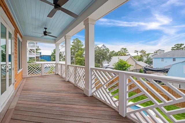 wooden deck featuring ceiling fan