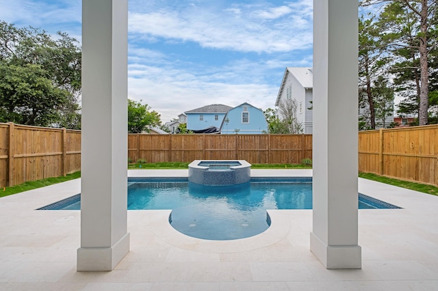 view of swimming pool featuring an in ground hot tub