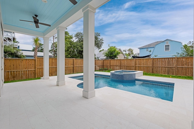 view of pool featuring an in ground hot tub, ceiling fan, and a patio area