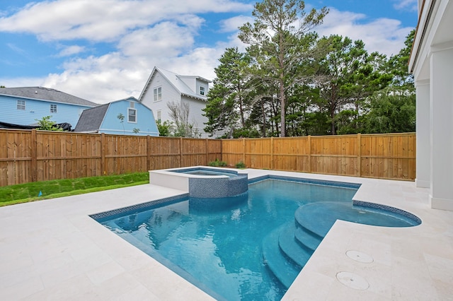 view of swimming pool featuring an in ground hot tub and a patio