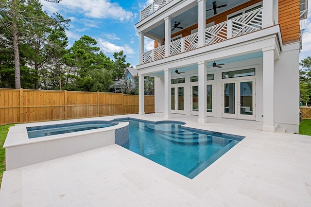 view of swimming pool featuring an in ground hot tub, french doors, ceiling fan, and a patio area