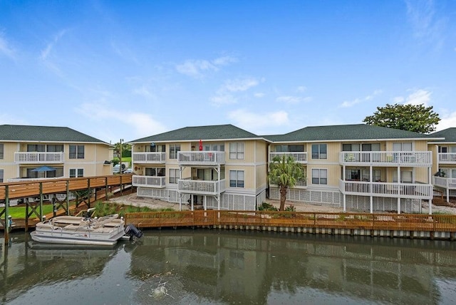 back of house with a water view