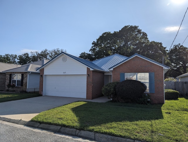 ranch-style home with brick siding, an attached garage, driveway, and a front lawn