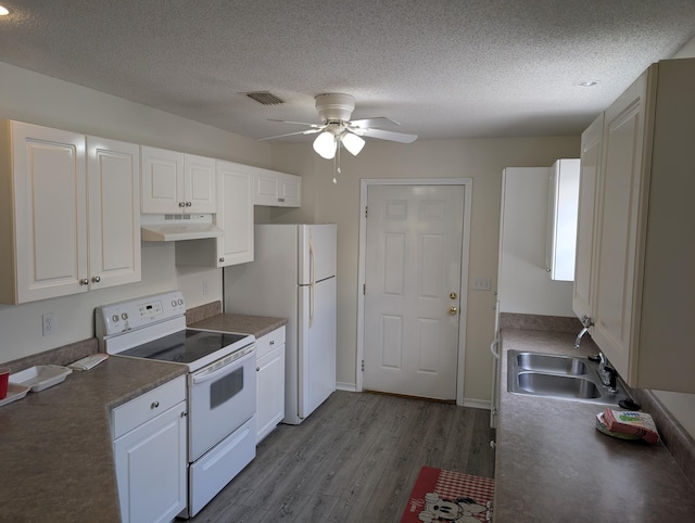 kitchen with white appliances, a ceiling fan, under cabinet range hood, a sink, and wood finished floors