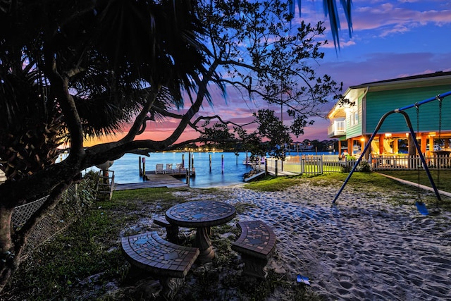 yard at dusk with a water view